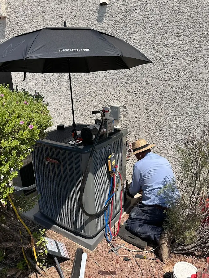 HVAC technician performing outdoor AC maintenance in Virginia Beach